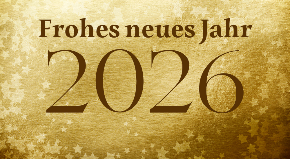 Der Schriftzug „Frohes neues Jahr 2026“ steht auf einem goldenen Blatt, das mit weißen Sternen versehen ist. 
